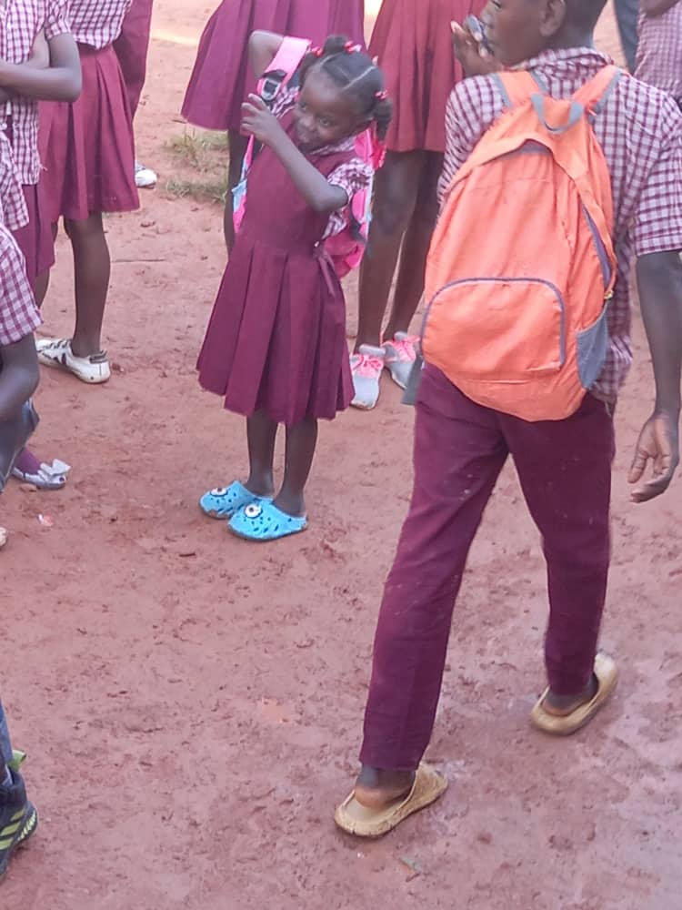 Girl carrying a torn and worn backpack