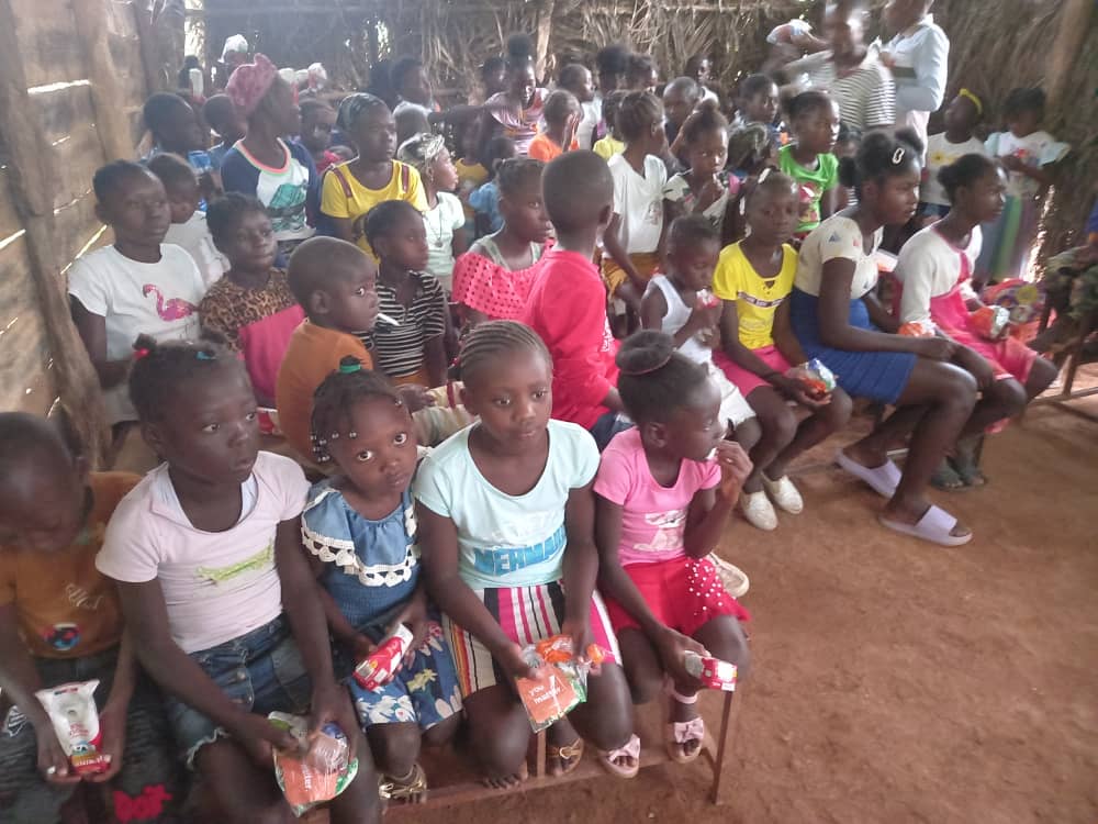 Dozens of children gathered in a community meeting space