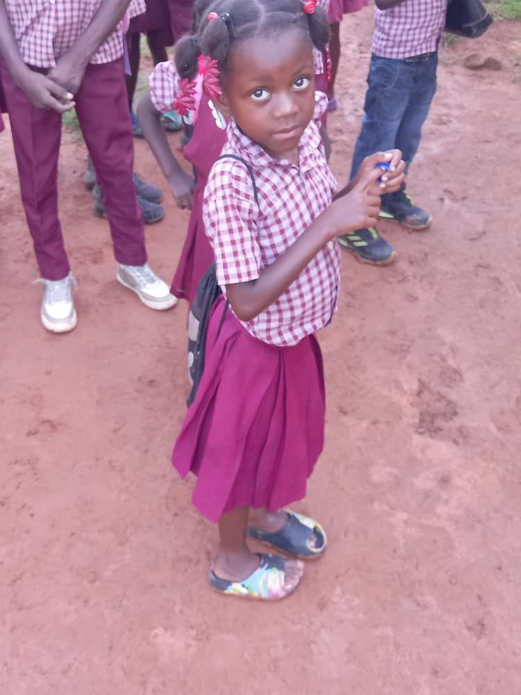 All the children joyfully raising food packages in the air